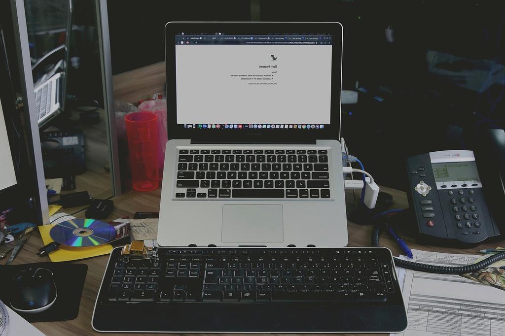 Software developer working on fintech code on multiple screens